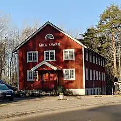 Two story red building with pointed roof