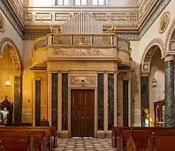View of the narthex, the choir loft, and pipe organ