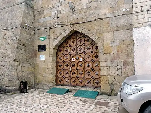 A closed door with two ramps