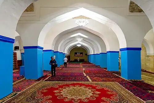 A wide, blue-and-white corridor