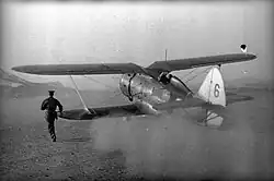 A Northern Fleet Air Force Polikarpov I-153 fighter taking-off from an airfield, 1941