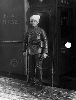 Rudolf Augustovich Peterson (1918-1920): He wears a white civilian papakha with an otherwise typical Red Sotnia uniform sans arm badge.