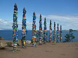 Serges heavily adorned with ribbons and scarves at Cape Burhan on Olkhon Island
