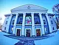 Tuymazy Drama Theater&nbsp;[ru] (Russian: Туймазинский драматический театр). inscription on the building "Happy New Year" (Tatar: Яңа ел белән)