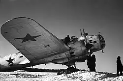 Aircraft maintenance technicians performing pre-flight preparation of an Ilyushin DB-3B torpedo bomber of the Northern Fleet Air Force 1st Guards Mine-Torpedo Aviation Regiment, January–March 1943