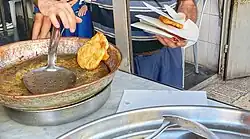 Tamriyeh at a shop being remove from the frying oil