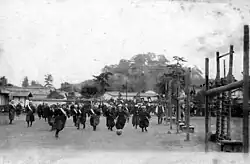 Image 29Japanese high-school girls playing football in their traditional hakama with one team wearing sashes (c. 1920) (from Women's association football)