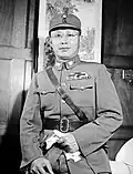 A Chinese man with glasses in a military uniform