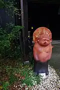 A tanuki statue modeled after a Buddha.