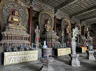 Ming dynasty statues of the Five Tathāgatas in Shanhua Temple in Datong, Shanxi, China. From left to right: Baosheng Fo, Amituofo, Piluzhena Fo, Achu Fo, Bukong Chengjiu Fo