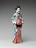 Female figure; c. 1670–1690; porcelain with overglaze polychrome enamels; height: 39.7&nbsp;cm; Metropolitan Museum of Art (New York City)