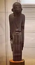 The stylistically similar "MacGregor Man", with long beard and penile sheath.[74]