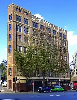 Griffiths Teas building in Sydney, viewed from Wentworth Ave, with Commonwealth St on left. The facades facing these streets form an acute angle, May 2014