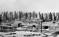 Old photo of many oil wells