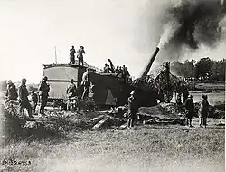 A gun of the 53rd Coastal Artillery, 80th division near Verdun, France. Four shots were fired at a German rail head 30&nbsp;km away and aerial observers confirmed four hits.[9]