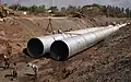 114" pipe installation; Pipe: 114" aluminized type 2; Flow: 25 cubic meters/second; This is a storm drain in Guasave, Mexico