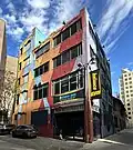 The site of the Krazy Kat in 2023. The entrance seen in other photos is on the opposite side of the current building.
