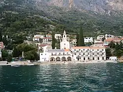 Seaside view of Brist with Hotel Riva and the Church of St. Margaret the Martyr, patron saint