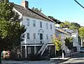 Original Stephen Rowe's tavern and store (1804), 182 Front Street, and other houses of the early 19th century oystering village on Front Street North of the Grand Avenue Bridge.