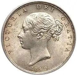 Silver coin with a woman's head facing left