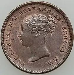 Copper coin with a woman's head facing left