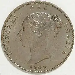Copper coin with a woman's head facing left