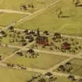 An aerial view of the First Catholic Church in Lansing, as "15. Catholic Church" in Albert Ruger's Bird's Eye View of Lansing (1866), (cf. [1]). This was drawn prior to the three additions, the spire, and construction of the parsonage and parochial school. This also shows the original apse at the back of the church where later additions would be made.
