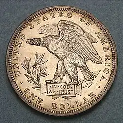Defiant eagle, facing left. Text reads UNITED STATES OF AMERICA / IN GOD WE TRUST / ONE DOLLAR
