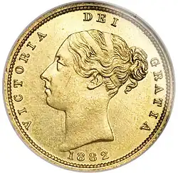 Gold coin with a woman's head facing left