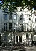 19 Grand Parade, Brighton (right), Pike's early 20th-century residence and business address