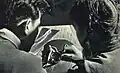 Student of BCCM learns to differentiate Asian ginseng from other herbs. March 1963, People's Pictorial.