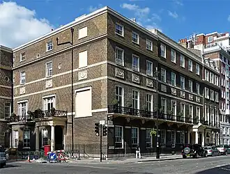 20–21 Portman Square, built by James and Samuel Wyatt. The white panels are Coade Stone. (See §&nbsp;Examples: Portman Square.)