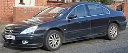 Bumpers are black plastic rather than chrome, different wheel and fog light design to later models