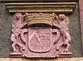 Coat of arms at gate to Schloss Mühlenburg