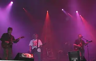 Several people playing instruments on a stage