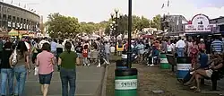 Multiple people walking in the Grand Concourse, located between the Grandstand and the Varied Industries Building in 2006.