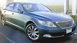 Quarter view of sedan parked outdoors.