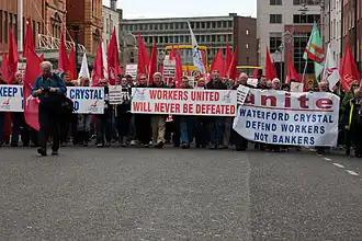 Protestors with banners marching on the streets of Dublin