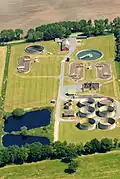 Image 4A wastewater treatment plant in Cuxhaven, Germany. Wastewater treatment is a process used to remove contaminants from wastewater or sewage and convert it into an effluent that can be returned to the water cycle with acceptable impact on the environment, or reused for various purposes (called water reclamation)