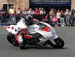 2013 Isle of Man TT&nbsp; TT Zero Practice Session Mark Miller (2) MotoCzysz E1pc at Parliament Square, Ramsey 3 June 2013.