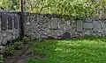 Gravestones in the wall fence