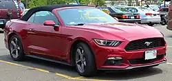 Front three-quarters view of a dark red convertible