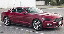Front three-quarters view of a red coupe