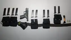 Several magazines, pouches, and a pistol