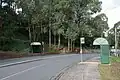 Bus stops on McNicol Road near Tecoma station, May 2023