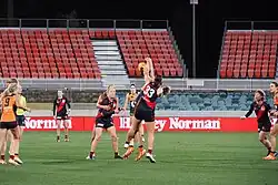 Players contest the football
