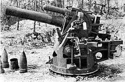 A captured 20 cm short gun with its ammunition.
