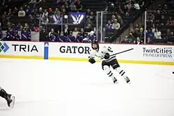 Rattray on the ice in hockey gear