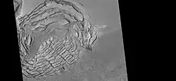 Large group of concentric cracks, as seen by HiRISE, under HiWish program Location is Ismenius Lacus quadrangle. Cracks were formed by a volcano under ice.[130]