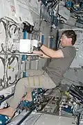 NASA Image: ISS019E005715 (11 April 2009) Astronaut Michael Barratt, Expedition 19/20 flight engineer, performs an insertion of urine samples into the Minus Eighty Degree Laboratory Freezer for ISS (MELFI) as part of the Nutritional Status Assessment (NUTRITION) study in the Japanese Kibo laboratory of the International Space Station.